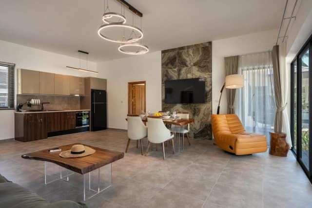 Deluxe villa dining area opening onto the terrace